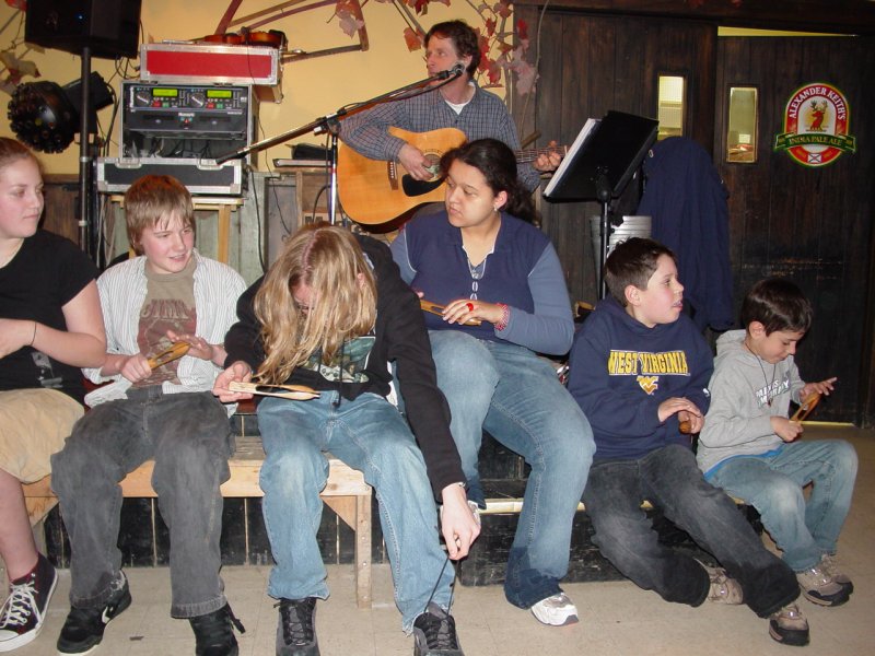 Ted and Tom playing wooden spoons